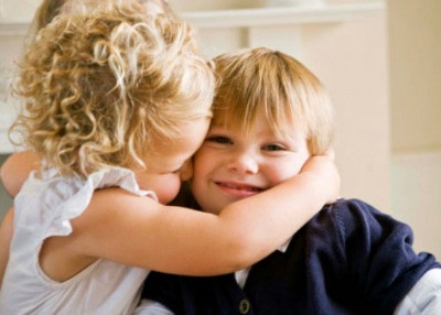 Girl kissing boy