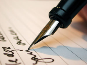 man writing a contract